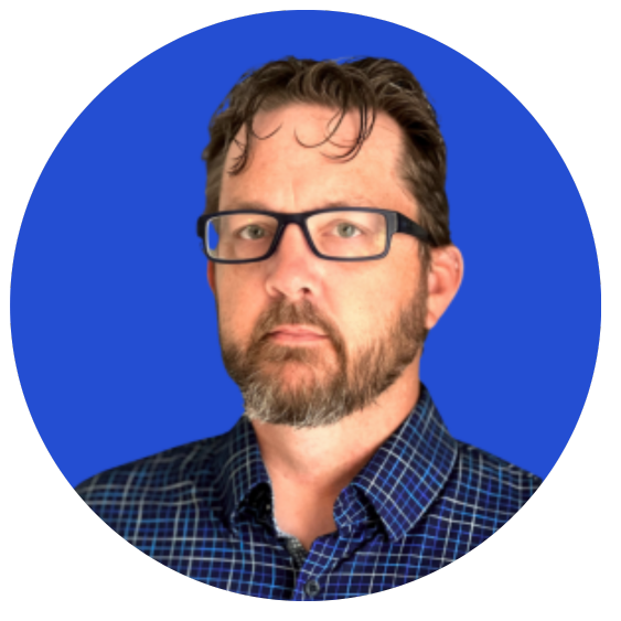 Man with glasses on blue background